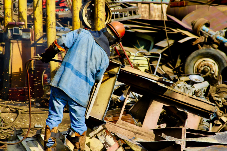 Man working in scrap metal yard
