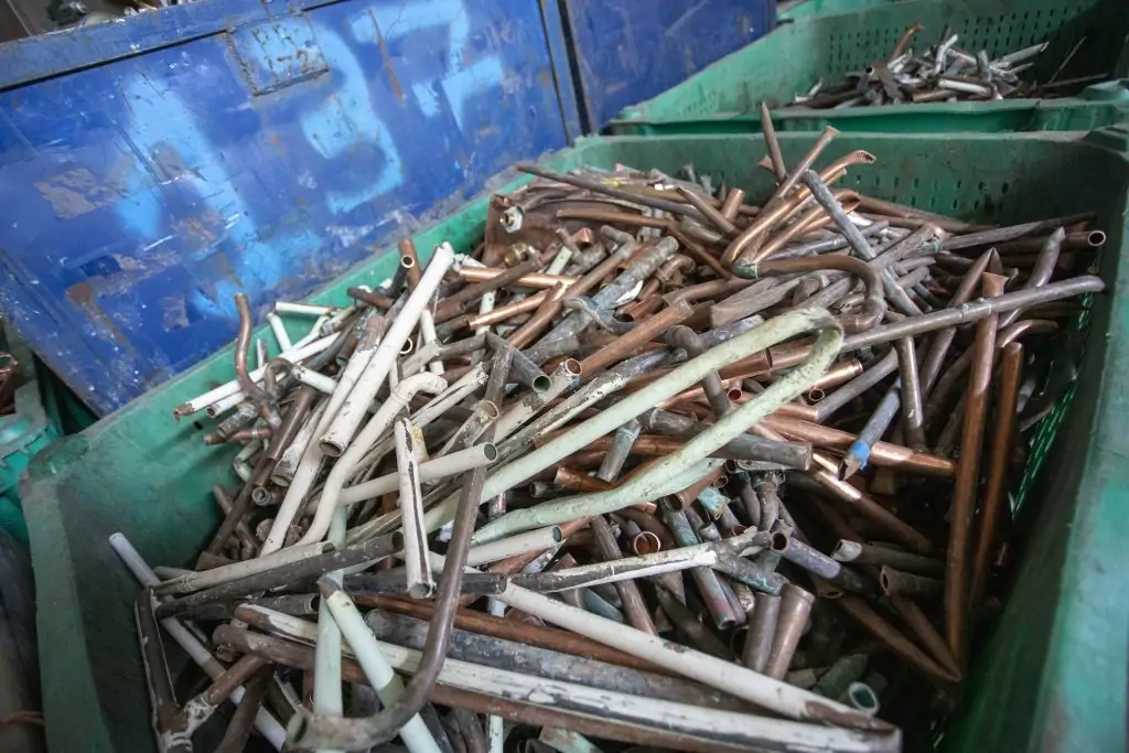 a box full of different copper pipes